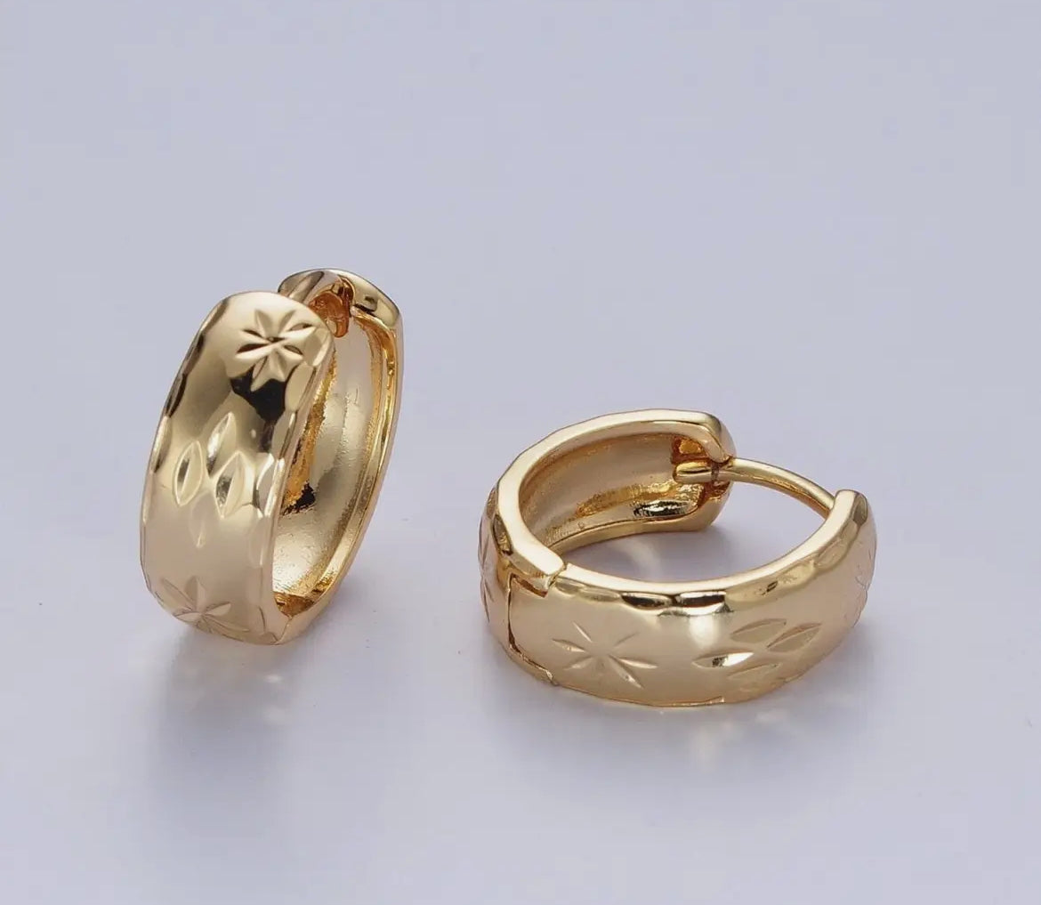 Gold hoops with textured northstar Huggies